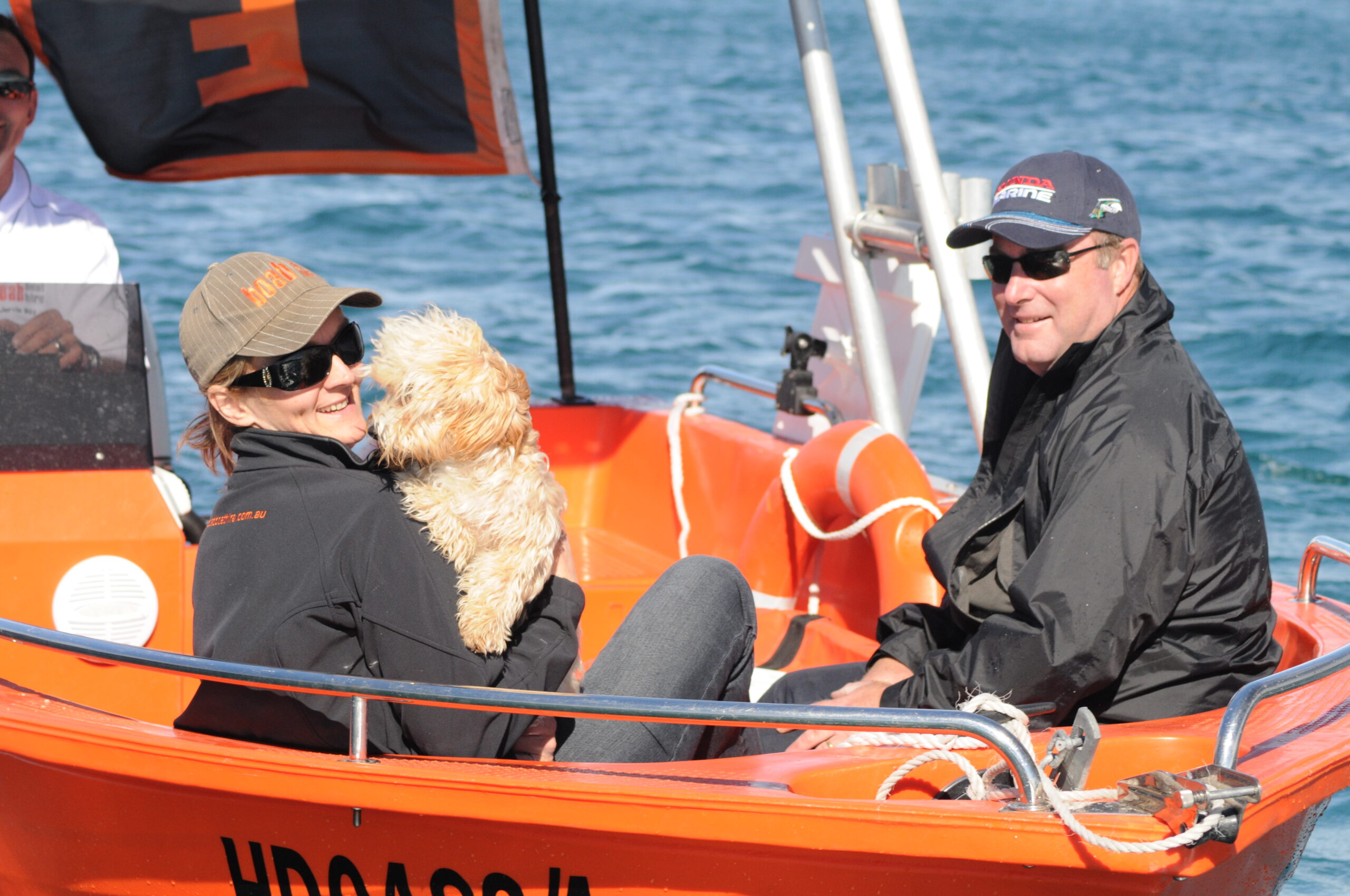 Couple enjoying a runabout boat on the water with Boab Boats Hire